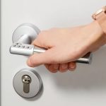 ASSA ABLOY Code Handle standalone digital PIN door handle installed on an office door.