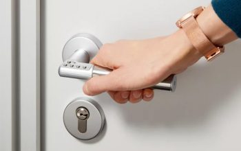 ASSA ABLOY Code Handle standalone digital PIN door handle installed on an office door.