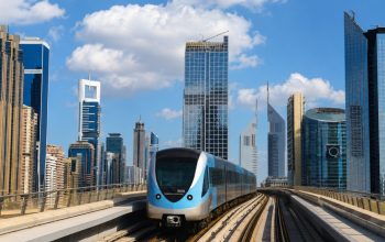 Modern metro train and Dubai skyline illustrating advanced fire detection system performance and smart building safety.