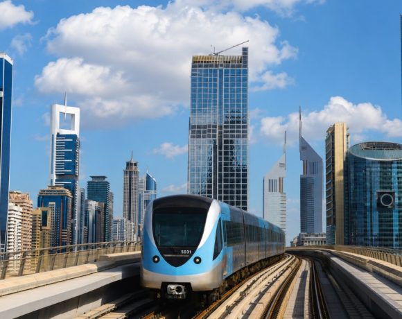 Modern metro train and Dubai skyline illustrating advanced fire detection system performance and smart building safety.