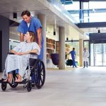 Healthcare staff using an integrated IP public address and emergency communication system in a modern hospital