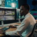 Security operator using Genetec video management software in a surveillance control room