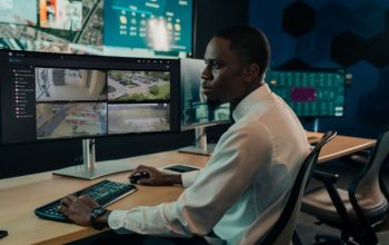 Security operator using Genetec video management software in a surveillance control room